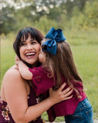 AJ hugging her daughter