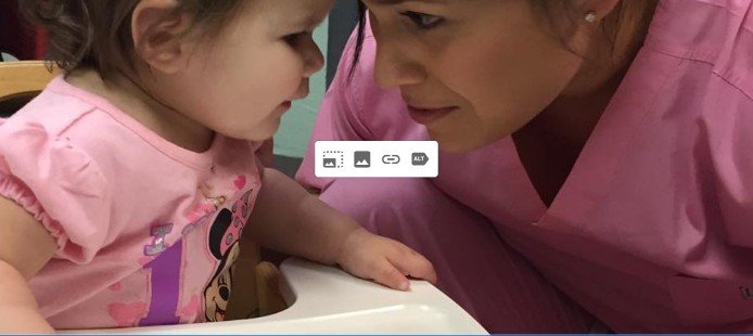 AJ with her daughter in a high chair